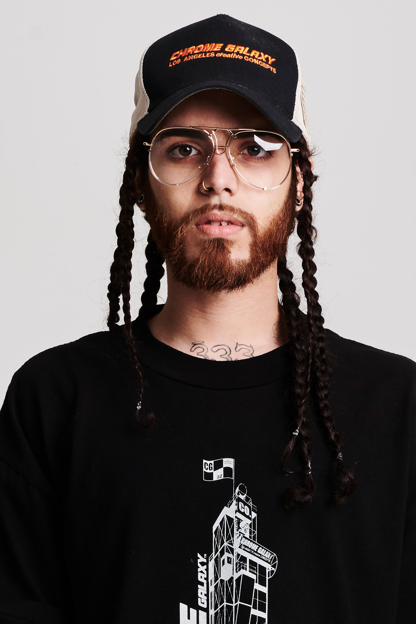 BLACK FRONT TAN MESH EMBROIDERED LOGO TRUCKER HAT | CHROME GALAXY